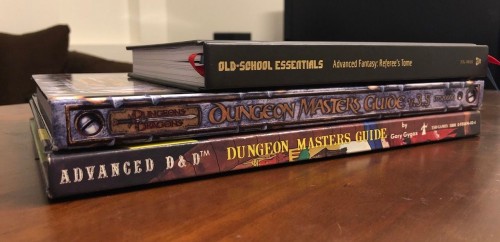 The OSE ref's book, the 3rd edition DMG, and the AD&D DMG stacked up.
