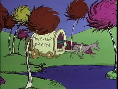 A still of the Once-ler wagon arriving, from the original 1970s Lorax.